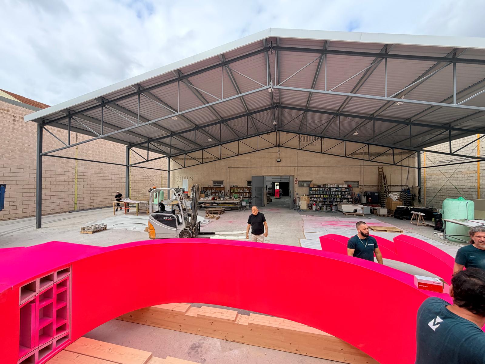 Workshop courtyard with assembled arch sections